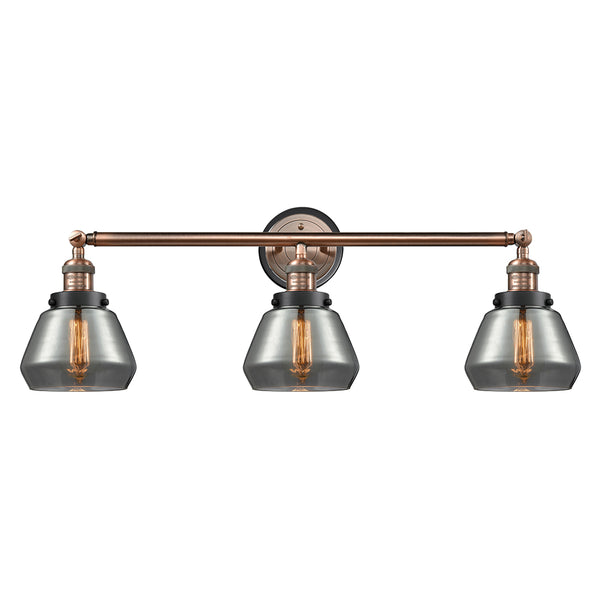 Fulton Bath Vanity Light shown in the Antique Copper finish with a Plated Smoke shade