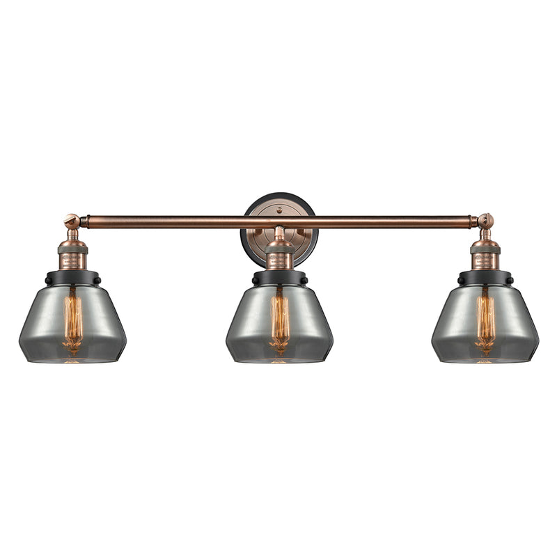 Fulton Bath Vanity Light shown in the Antique Copper finish with a Plated Smoke shade