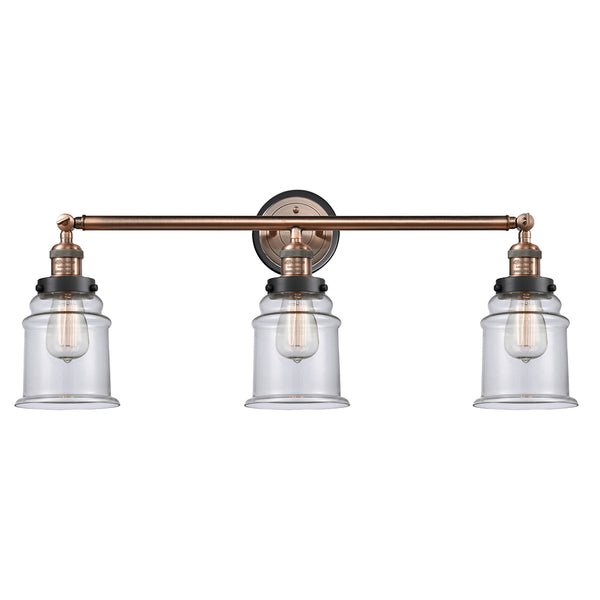 Canton Bath Vanity Light shown in the Antique Copper finish with a Clear shade