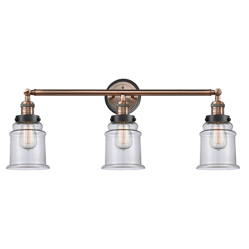 Canton Bath Vanity Light shown in the Antique Copper finish with a Clear shade