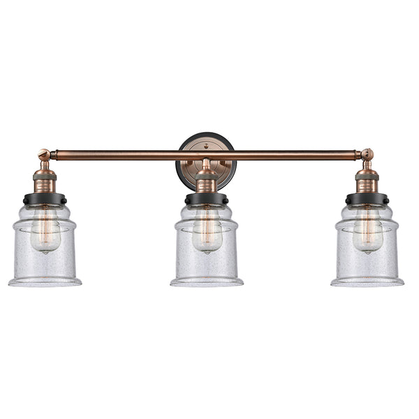 Canton Bath Vanity Light shown in the Antique Copper finish with a Seedy shade