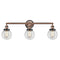 Beacon Bath Vanity Light shown in the Antique Copper finish with a Clear shade
