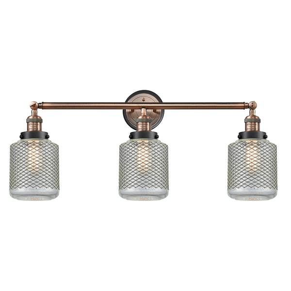 Stanton Bath Vanity Light shown in the Antique Copper finish with a Clear Wire Mesh shade