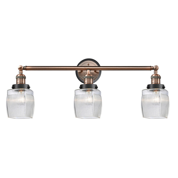 Colton Bath Vanity Light shown in the Antique Copper finish with a Clear Halophane shade