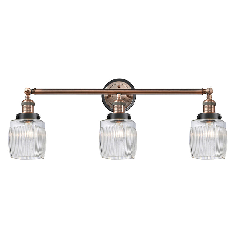Colton Bath Vanity Light shown in the Antique Copper finish with a Clear Halophane shade