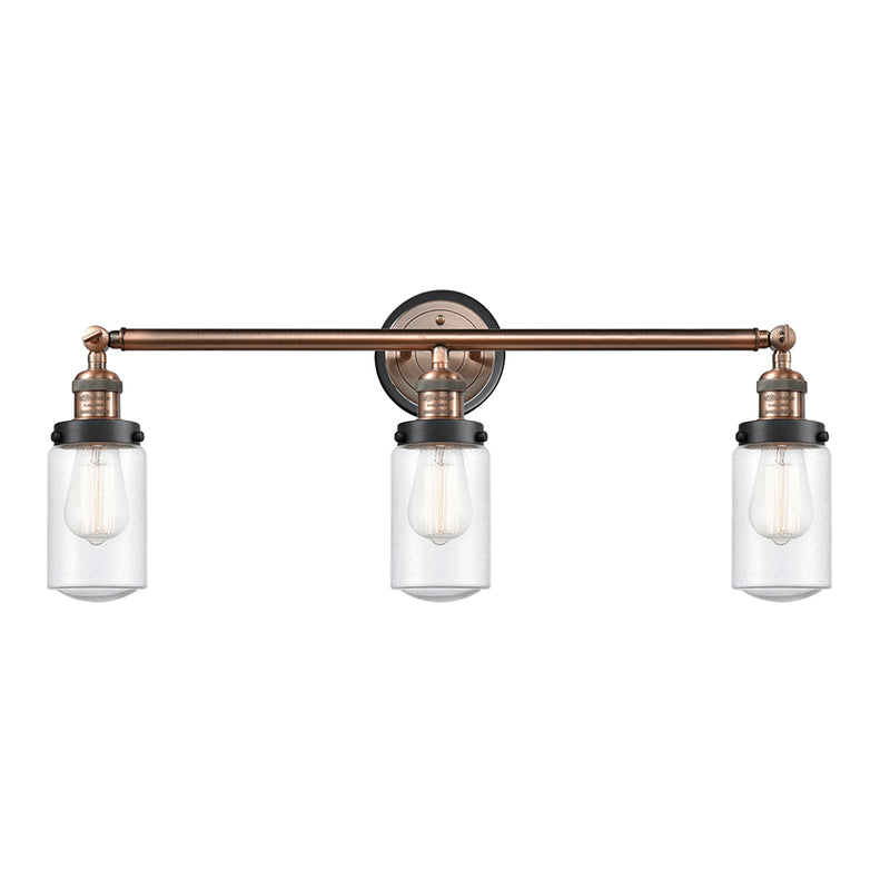Dover Bath Vanity Light shown in the Antique Copper finish with a Seedy shade