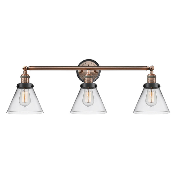 Cone Bath Vanity Light shown in the Antique Copper finish with a Clear shade