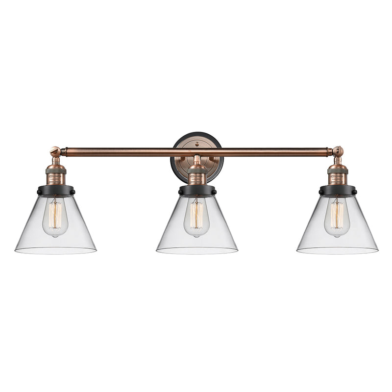 Cone Bath Vanity Light shown in the Antique Copper finish with a Clear shade