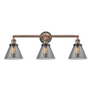 Cone Bath Vanity Light shown in the Antique Copper finish with a Plated Smoke shade