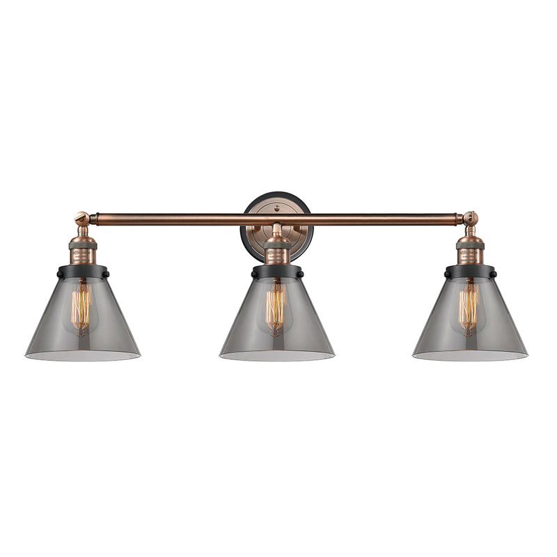 Cone Bath Vanity Light shown in the Antique Copper finish with a Plated Smoke shade