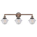Oxford Bath Vanity Light shown in the Antique Copper finish with a Seedy shade