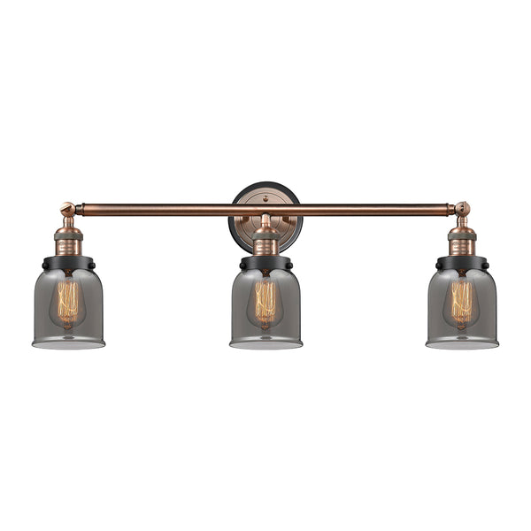 Bell Bath Vanity Light shown in the Antique Copper finish with a Plated Smoke shade