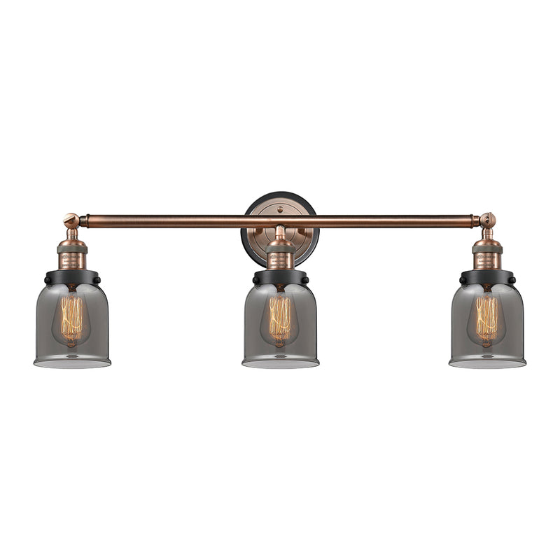 Bell Bath Vanity Light shown in the Antique Copper finish with a Plated Smoke shade