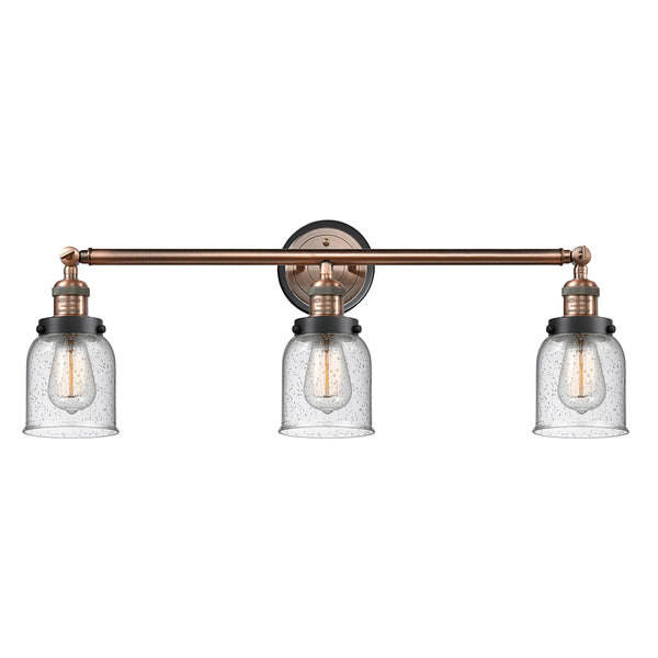 Bell Bath Vanity Light shown in the Antique Copper finish with a Seedy shade