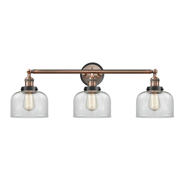 Bell Bath Vanity Light shown in the Antique Copper finish with a Clear shade