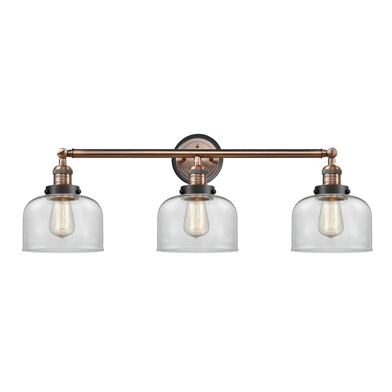 Bell Bath Vanity Light shown in the Antique Copper finish with a Clear shade