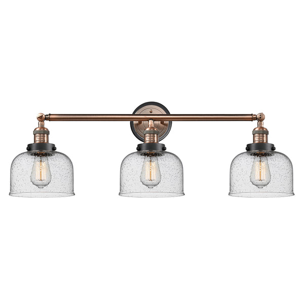 Bell Bath Vanity Light shown in the Antique Copper finish with a Seedy shade