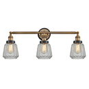 Chatham Bath Vanity Light shown in the Brushed Brass finish with a Clear shade