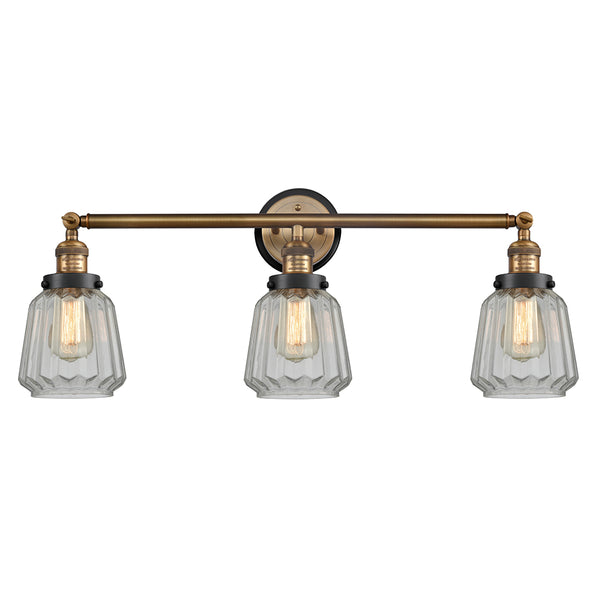 Chatham Bath Vanity Light shown in the Brushed Brass finish with a Clear shade