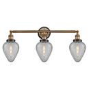 Geneseo Bath Vanity Light shown in the Brushed Brass finish with a Clear Crackled shade