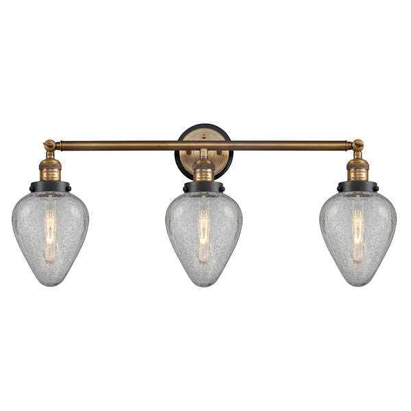 Geneseo Bath Vanity Light shown in the Brushed Brass finish with a Clear Crackled shade