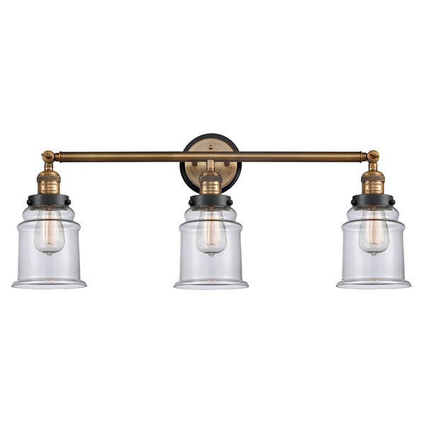 Canton Bath Vanity Light shown in the Brushed Brass finish with a Clear shade
