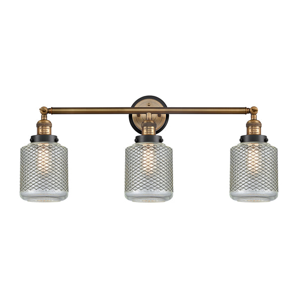 Stanton Bath Vanity Light shown in the Brushed Brass finish with a Clear Wire Mesh shade