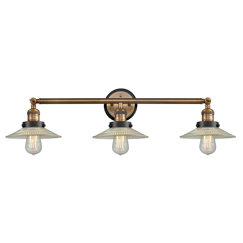 Halophane Bath Vanity Light shown in the Brushed Brass finish with a Clear Halophane shade