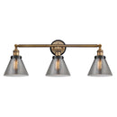 Cone Bath Vanity Light shown in the Brushed Brass finish with a Plated Smoke shade
