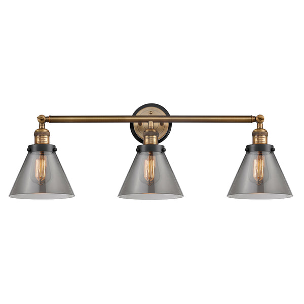 Cone Bath Vanity Light shown in the Brushed Brass finish with a Plated Smoke shade