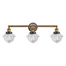 Oxford Bath Vanity Light shown in the Brushed Brass finish with a Clear shade