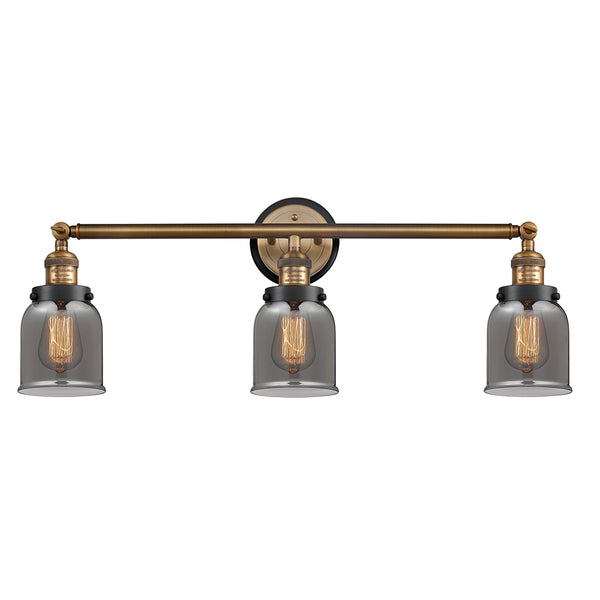 Bell Bath Vanity Light shown in the Brushed Brass finish with a Plated Smoke shade