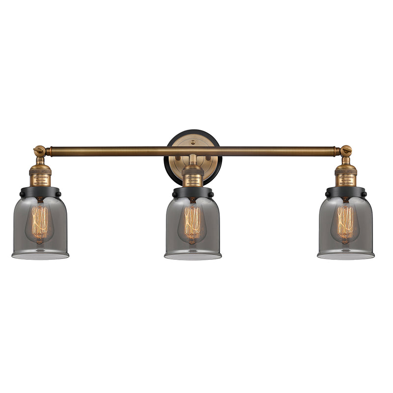 Bell Bath Vanity Light shown in the Brushed Brass finish with a Plated Smoke shade
