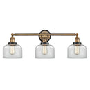 Bell Bath Vanity Light shown in the Brushed Brass finish with a Clear shade