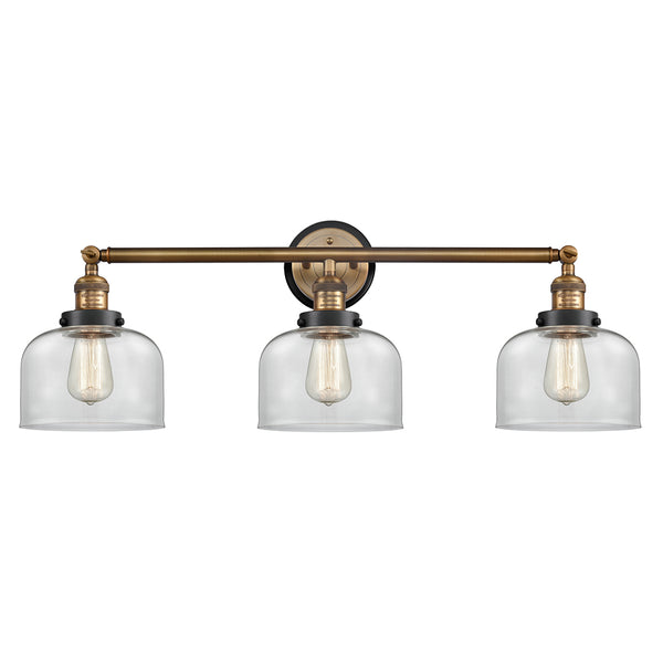 Bell Bath Vanity Light shown in the Brushed Brass finish with a Clear shade