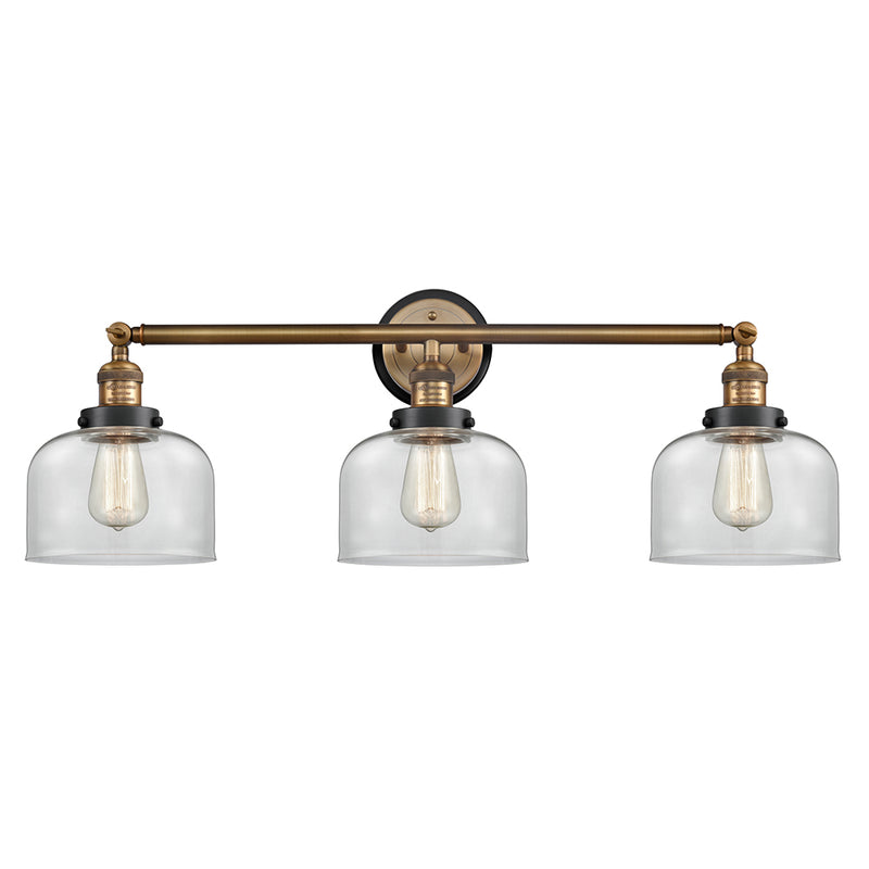 Bell Bath Vanity Light shown in the Brushed Brass finish with a Clear shade