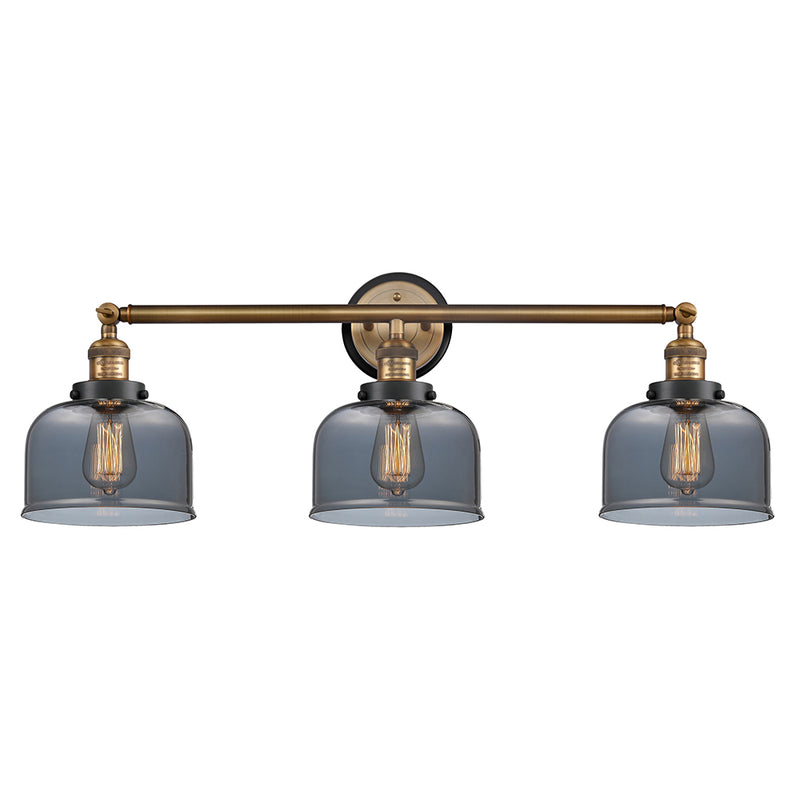 Bell Bath Vanity Light shown in the Brushed Brass finish with a Plated Smoke shade