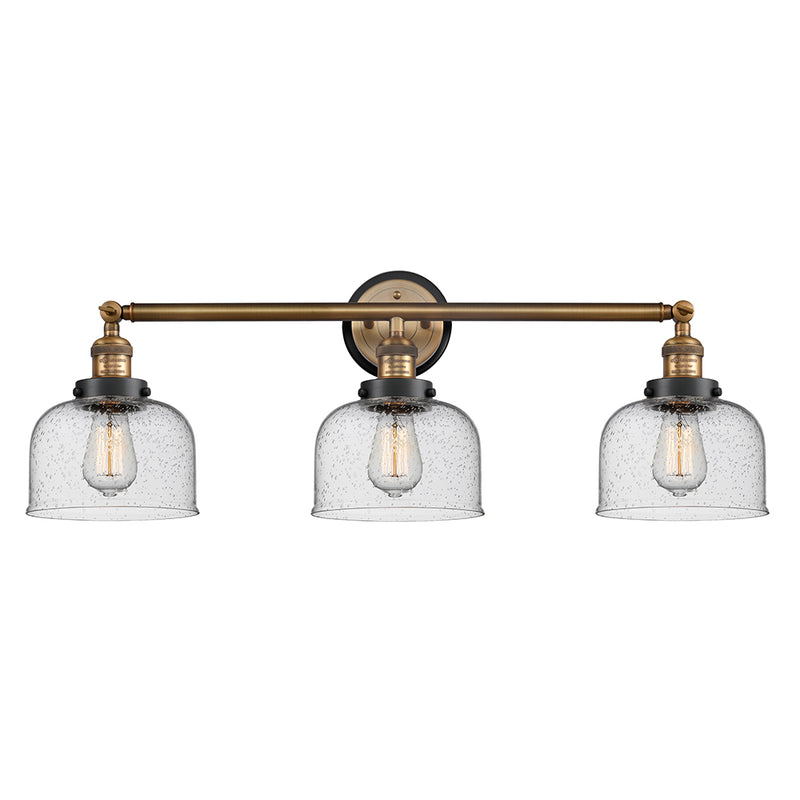 Bell Bath Vanity Light shown in the Brushed Brass finish with a Seedy shade
