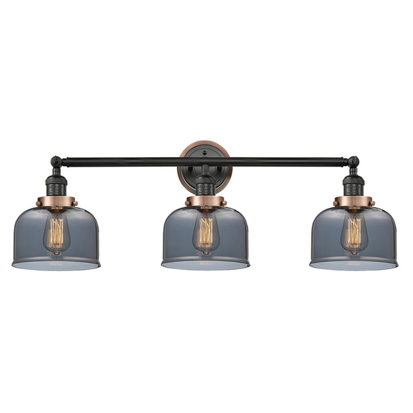 Bell Bath Vanity Light shown in the Matte Black finish with a Plated Smoke shade