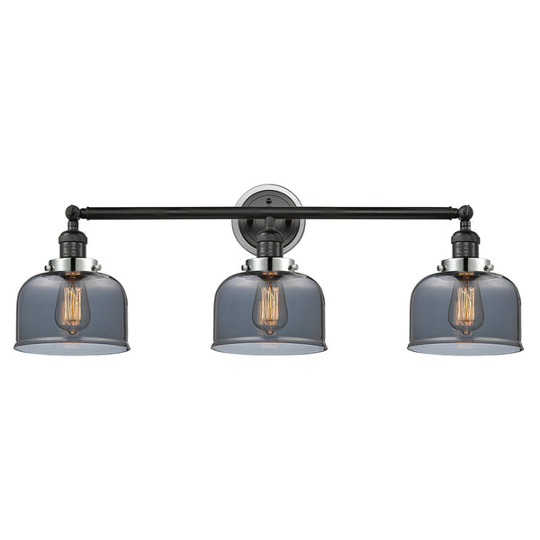 Bell Bath Vanity Light shown in the Matte Black finish with a Plated Smoke shade