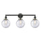 Beacon Bath Vanity Light shown in the Matte Black finish with a Seedy shade