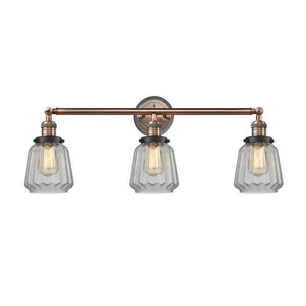 Chatham Bath Vanity Light shown in the Antique Copper finish with a Clear shade