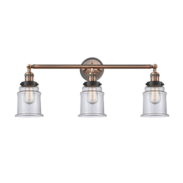 Canton Bath Vanity Light shown in the Antique Copper finish with a Clear shade