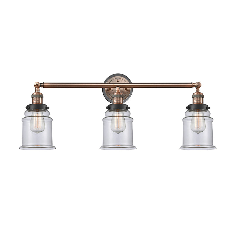 Canton Bath Vanity Light shown in the Antique Copper finish with a Clear shade
