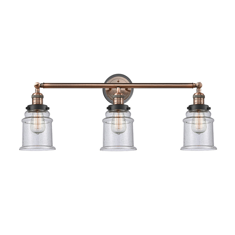 Canton Bath Vanity Light shown in the Antique Copper finish with a Seedy shade