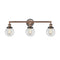 Beacon Bath Vanity Light shown in the Antique Copper finish with a Clear shade