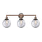 Beacon Bath Vanity Light shown in the Antique Copper finish with a Clear shade