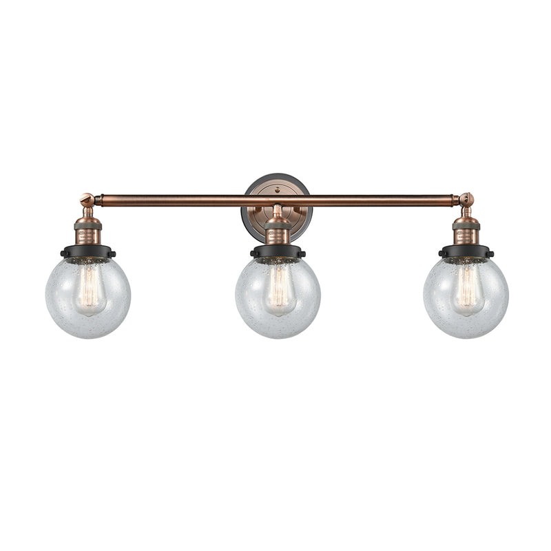 Beacon Bath Vanity Light shown in the Antique Copper finish with a Seedy shade