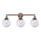 Beacon Bath Vanity Light shown in the Antique Copper finish with a Seedy shade