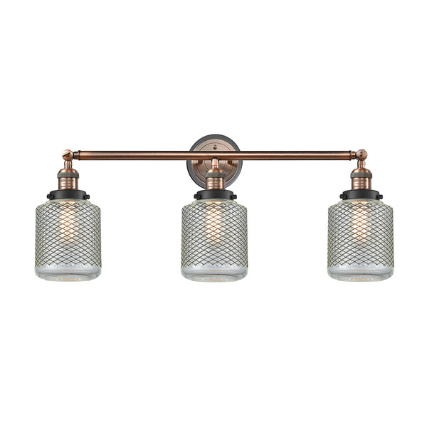 Stanton Bath Vanity Light shown in the Antique Copper finish with a Clear Wire Mesh shade